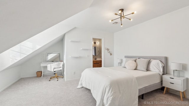 carpeted bedroom with lofted ceiling, connected bathroom, and a chandelier