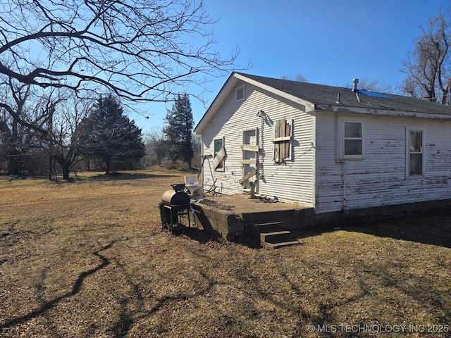 view of home's exterior featuring a yard