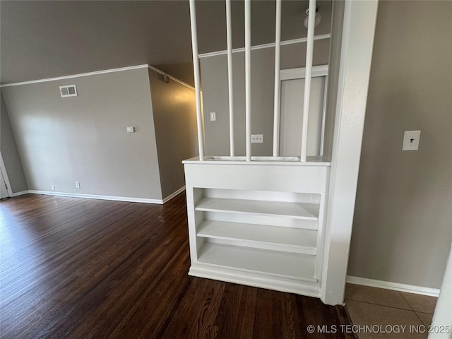 stairs featuring hardwood / wood-style flooring