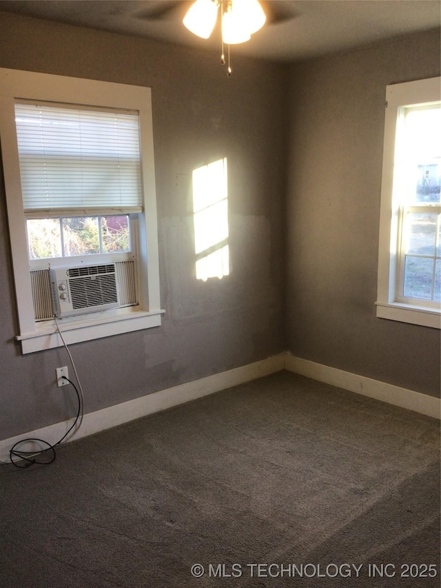 carpeted empty room with cooling unit and ceiling fan