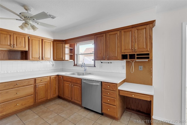 kitchen featuring sink, backsplash, stainless steel dishwasher, light tile patterned floors, and a textured ceiling