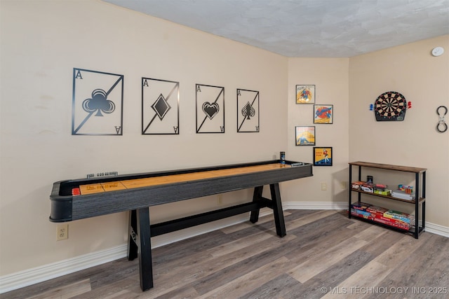 game room with wood-type flooring