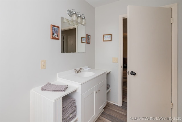 bathroom with vanity and hardwood / wood-style floors