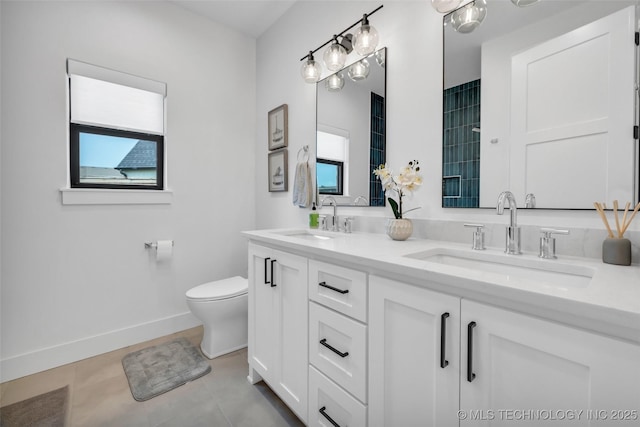 bathroom with tile patterned floors, vanity, and toilet