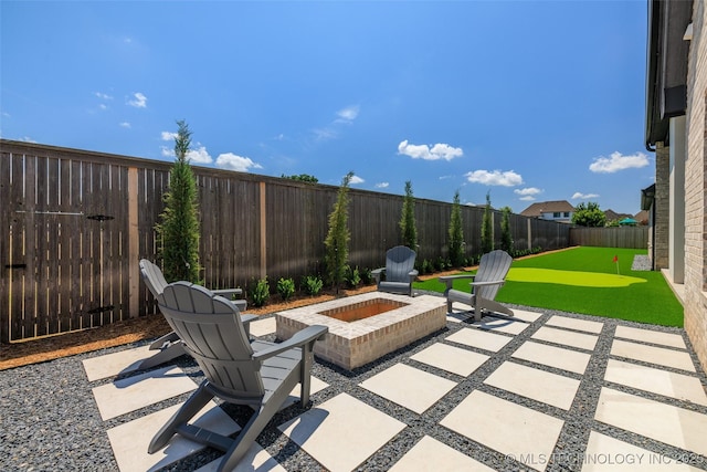 view of patio / terrace with an outdoor fire pit