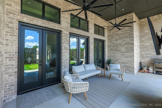 exterior space featuring outdoor lounge area, ceiling fan, and french doors