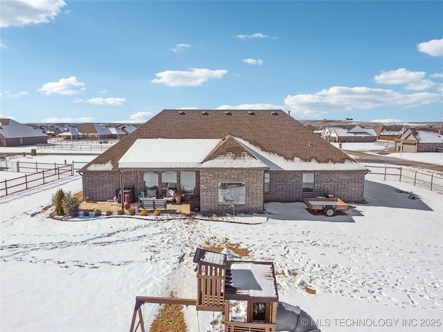 view of snow covered property