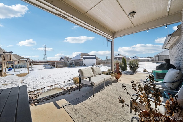 view of snow covered patio