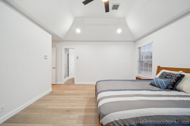 bedroom featuring lofted ceiling, ceiling fan, and light wood-type flooring