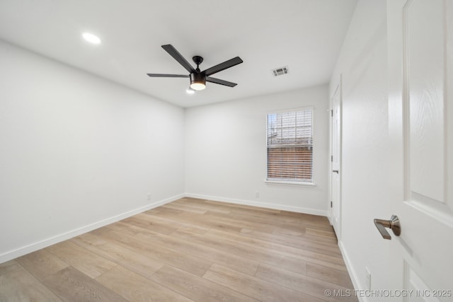 unfurnished room featuring ceiling fan and light wood-type flooring