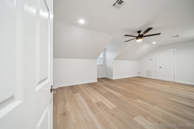 bonus room featuring ceiling fan, lofted ceiling, and light wood-type flooring