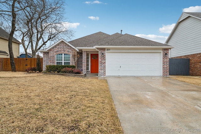 ranch-style house with a garage and a front lawn