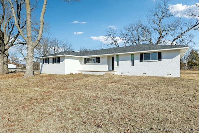 ranch-style house with crawl space, a shingled roof, a front lawn, and brick siding