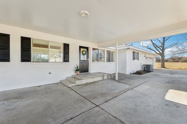 exterior space featuring a garage and central air condition unit