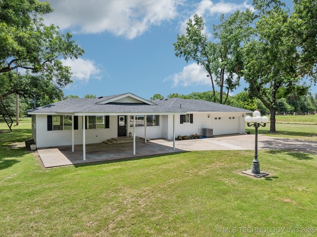10541 Sahoma Lake Rd, Sapulpa, OK 74066 - rear view of property featuring a yard, a garage, a patio, and driveway