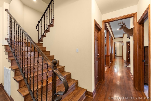 stairway with wood-type flooring