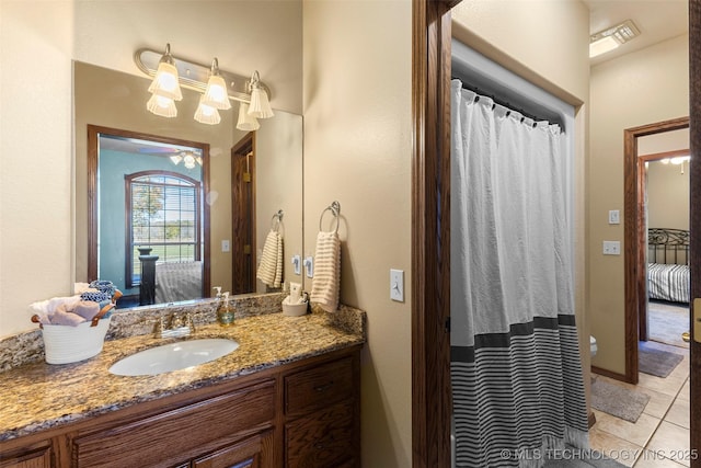 bathroom with tile patterned floors and vanity