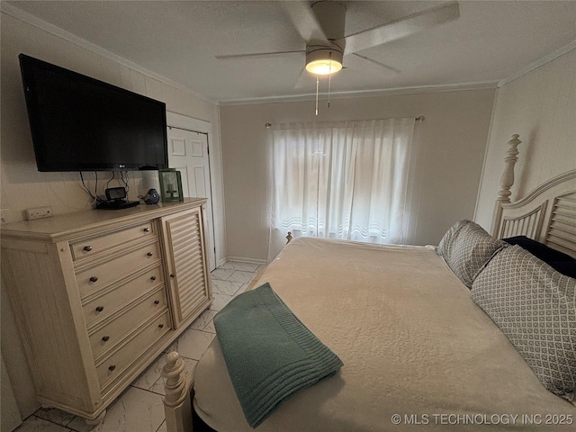 bedroom featuring ornamental molding, a closet, and ceiling fan