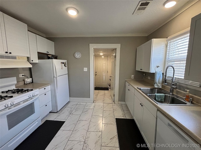 kitchen featuring sink, white appliances, ornamental molding, a textured ceiling, and white cabinets