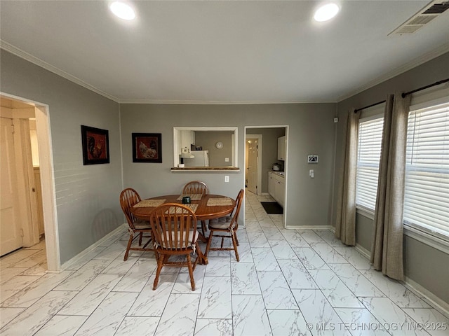 dining room with ornamental molding