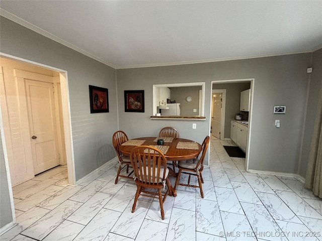 dining area with ornamental molding