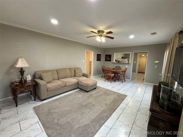 living room featuring crown molding and ceiling fan