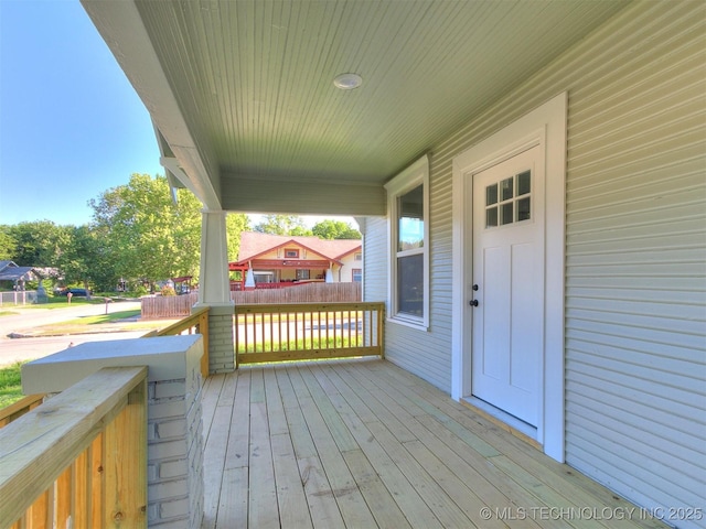 wooden terrace with a porch