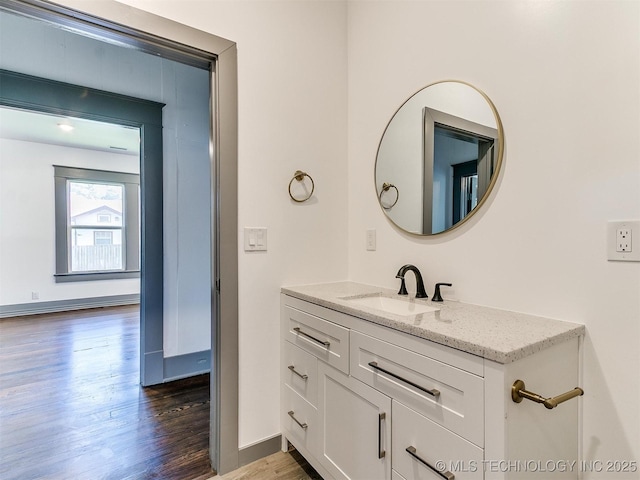 bathroom with vanity and wood-type flooring