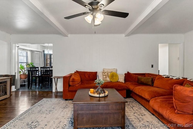 living room with beamed ceiling, dark hardwood / wood-style floors, ceiling fan with notable chandelier, and crown molding