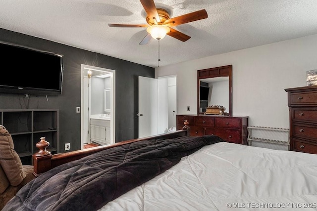 bedroom with ensuite bathroom, ceiling fan, and a textured ceiling