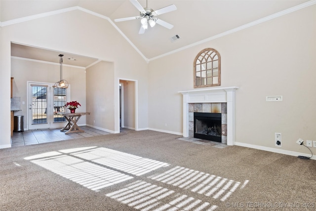 unfurnished living room with crown molding, high vaulted ceiling, light carpet, ceiling fan, and a fireplace