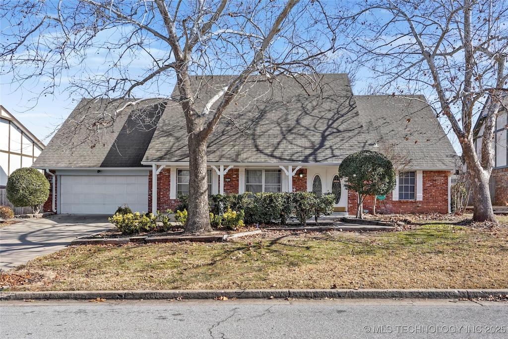 view of front of property with a garage and a front yard