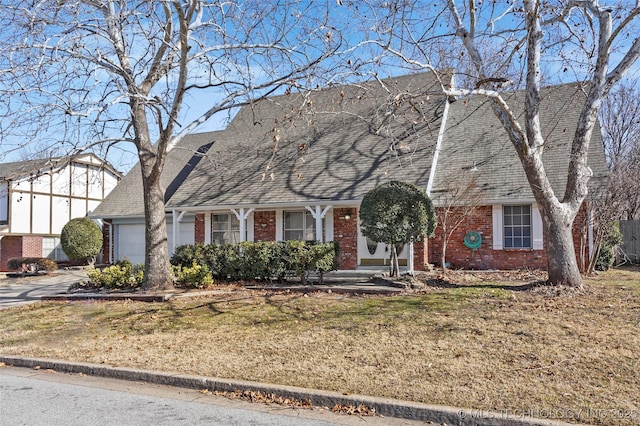 view of front of house featuring a garage and a front yard