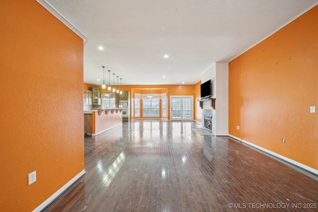 unfurnished living room featuring hardwood / wood-style floors