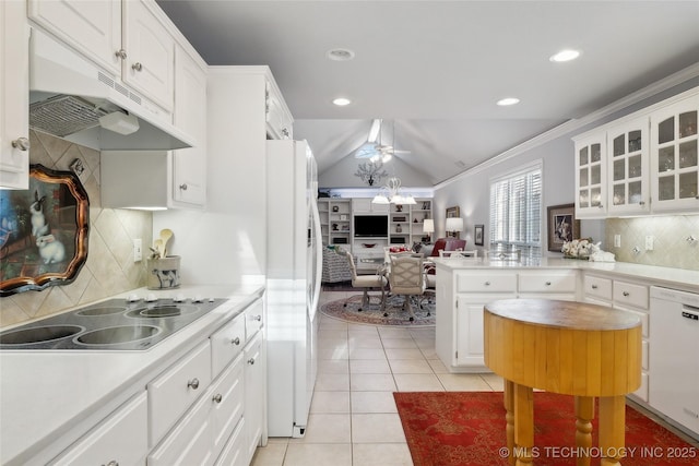 kitchen featuring light tile patterned flooring, an inviting chandelier, white cabinets, and white appliances