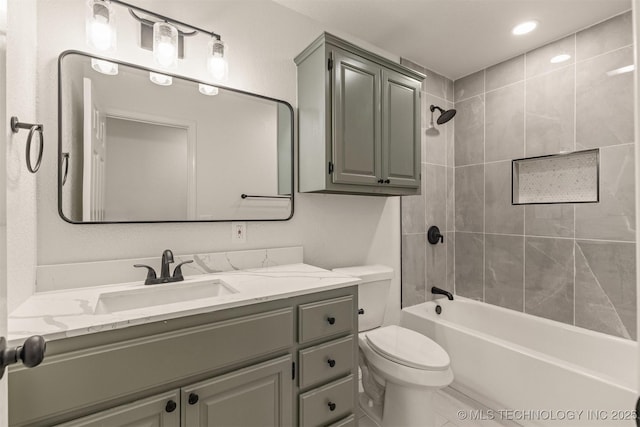 full bathroom with vanity, toilet, and tiled shower / bath