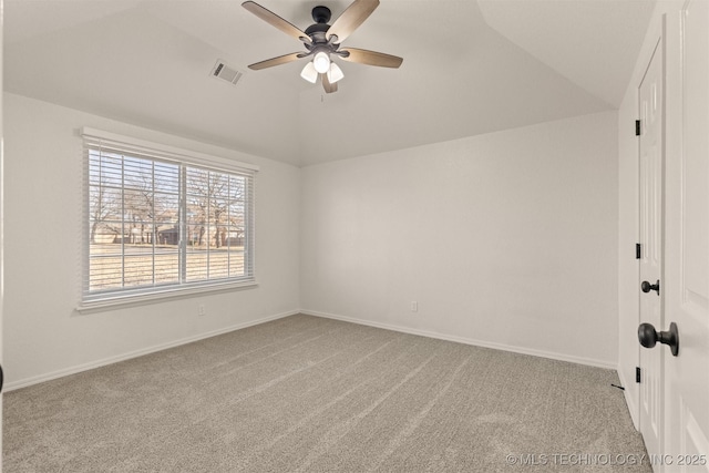 carpeted empty room with lofted ceiling and ceiling fan