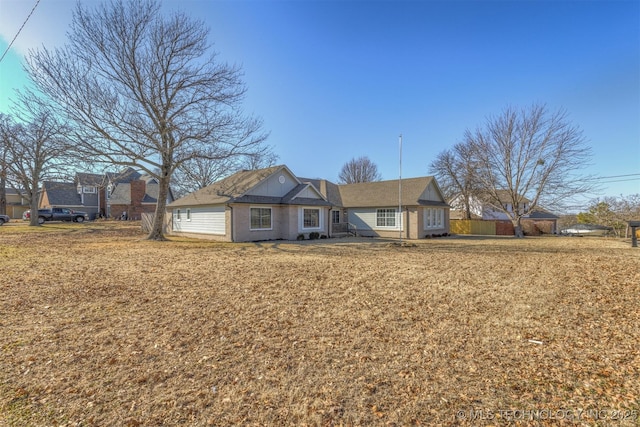 ranch-style home with a front yard