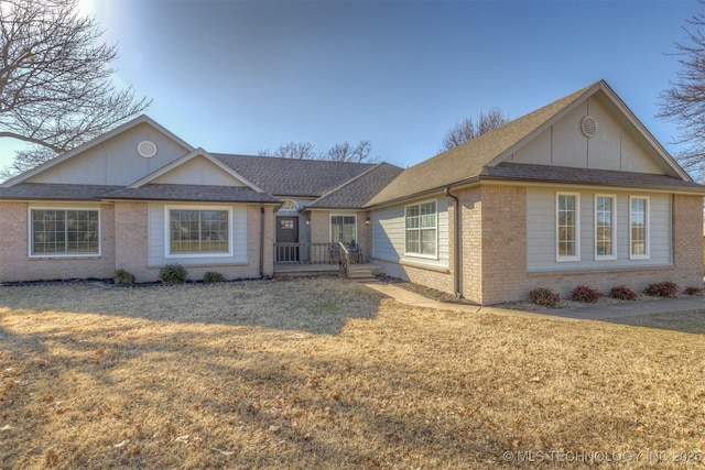 ranch-style home with a front lawn