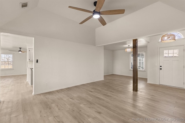 interior space featuring vaulted ceiling, ceiling fan, and light hardwood / wood-style flooring