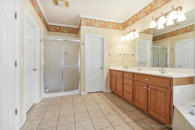 bathroom with crown molding, vanity, a shower with shower door, and tile patterned flooring