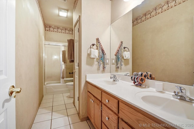 full bathroom featuring enclosed tub / shower combo, tile patterned floors, toilet, and vanity