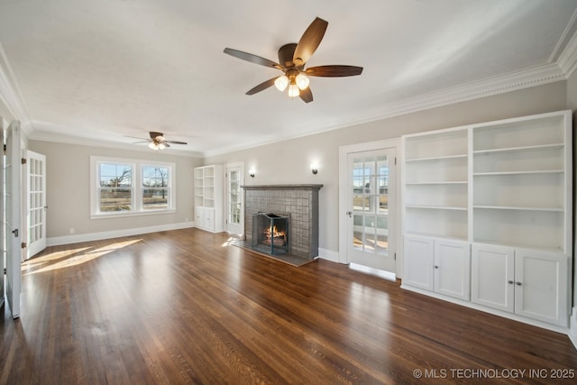 unfurnished living room featuring dark wood-type flooring, ceiling fan, ornamental molding, and a tile fireplace