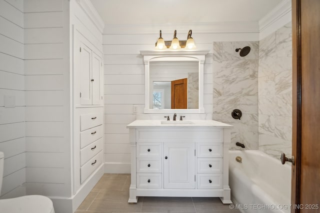 full bathroom featuring vanity, tiled shower / bath combo, tile patterned floors, and toilet