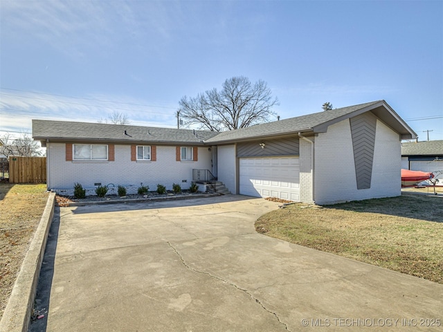 single story home featuring a garage and a front yard