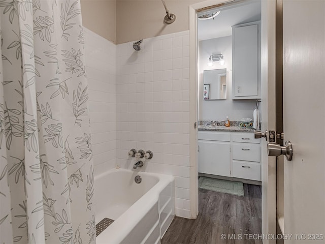 bathroom with vanity, wood-type flooring, and shower / bath combo with shower curtain