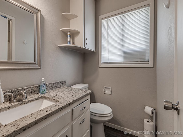 bathroom with vanity and toilet