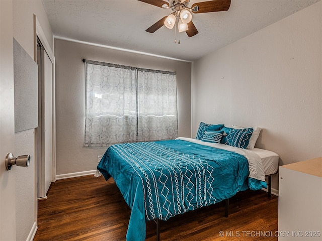 bedroom featuring dark hardwood / wood-style flooring and ceiling fan