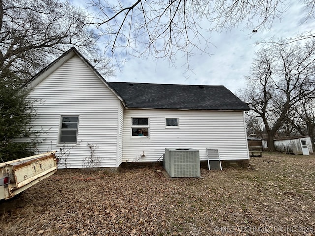 back of house with central AC