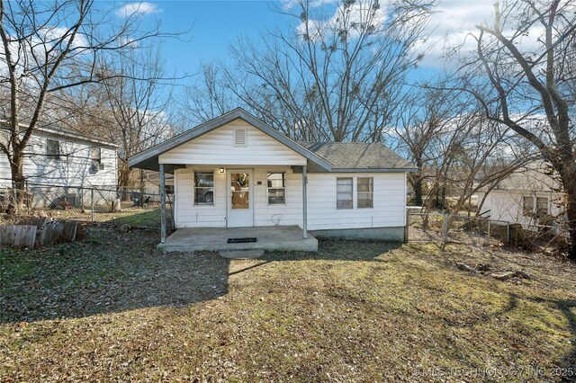 view of front of property with a porch and a front yard